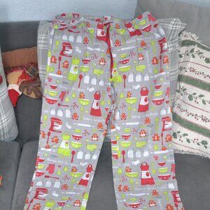 Pre- owned Holiday Themed Pajama with gingerbread and baking print. Size M.